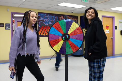Eastlake High School Students look excited to spin a wheel to win either a candy bucket or a gift card.