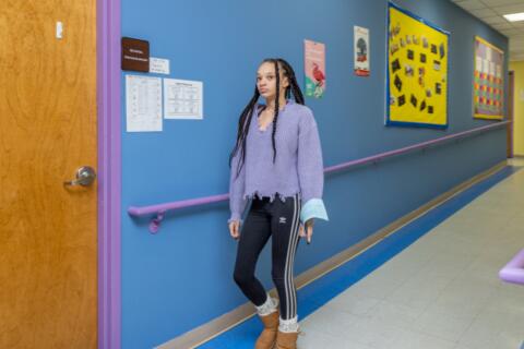 An Eastlake High School student walks the halls of school with a look of accomplishing a mission.