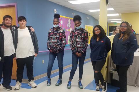 3 sets of “twins” pose together during a spirit week activity at Eastlake High School. The pairs are dressed alike.