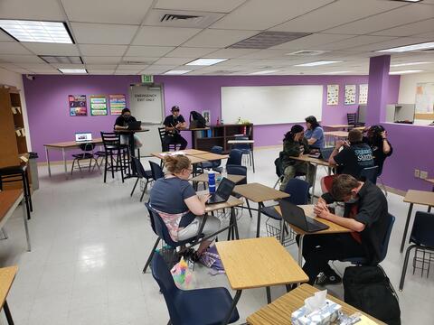 Eastlake High School students work independently on laptop computers in a classroom setting. 